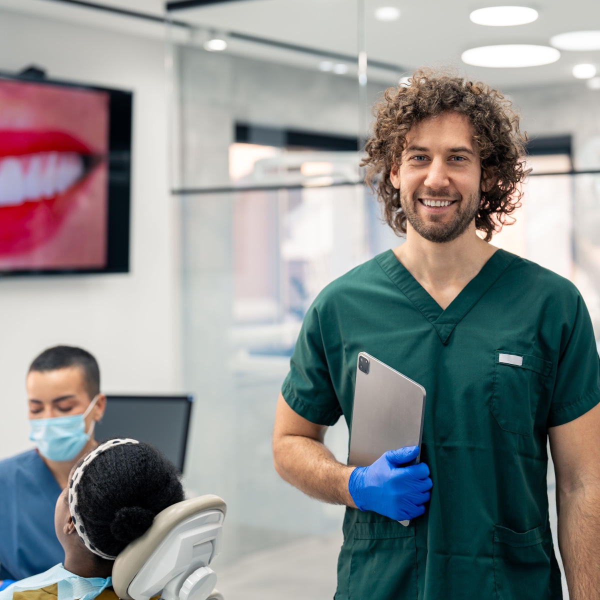 A smiling dentist with the OrthoPhoto app